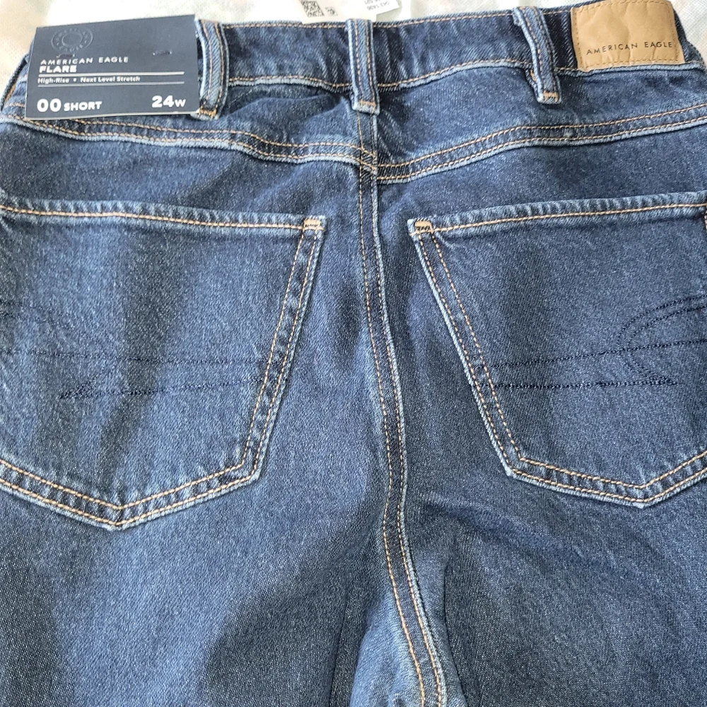 American Eagle Stretch High-Waisted Flare Jeans W/ Horsebit Chain Detail - Picture 6 of 9
